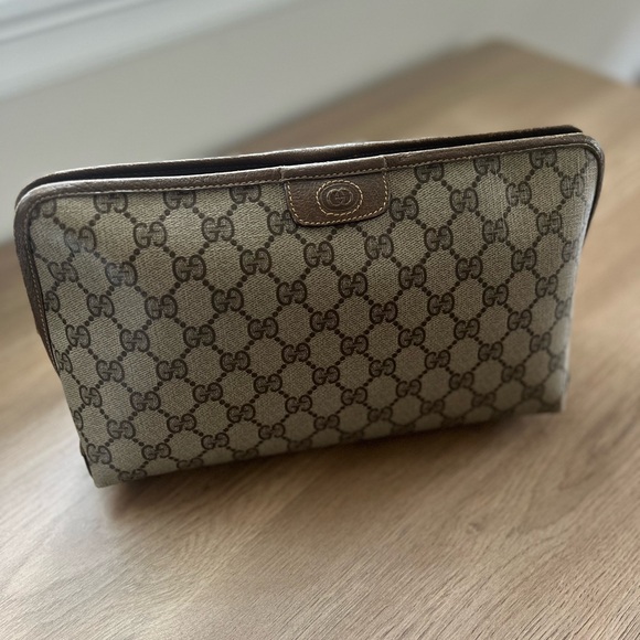 Slightly used Gucci monogrammed clutch bag - Picture 1 of 8